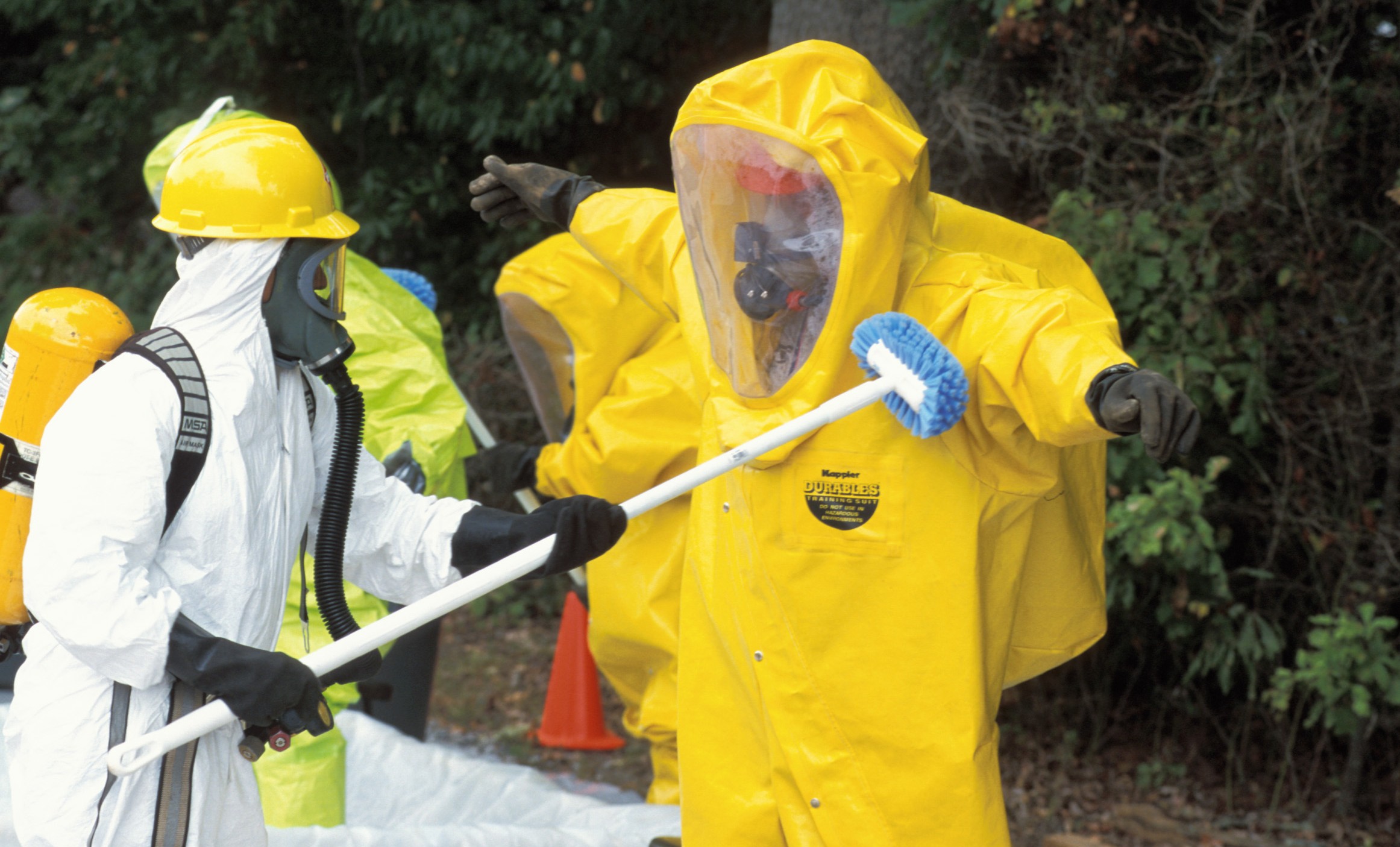 Hazardous waste decontamination of man wearing PPE